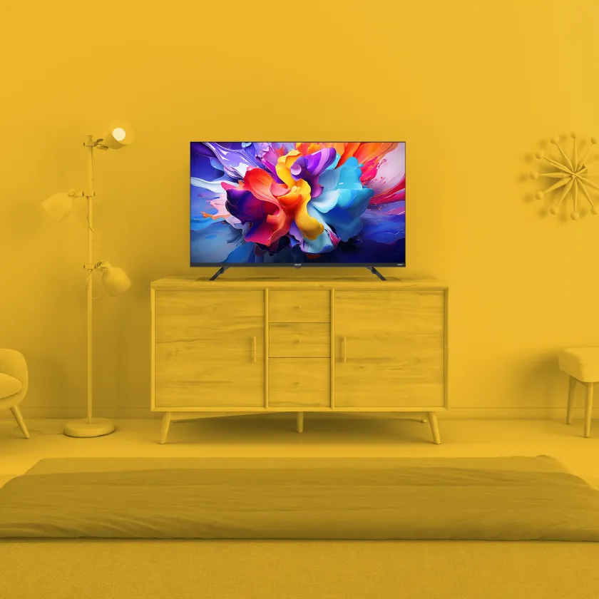 Element 43” 4K UHD HDR Frameless Xumo TV in monochrome yellow living room environment