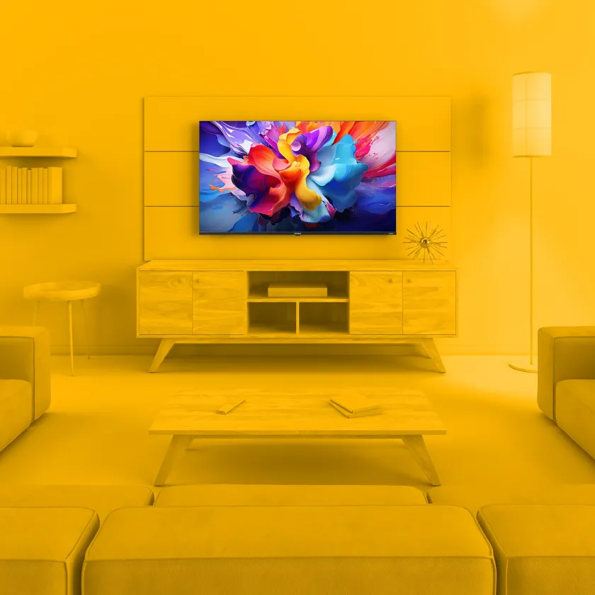 Element 50” 4K UHD HDR Frameless Xumo TV in monochrome yellow living room environment